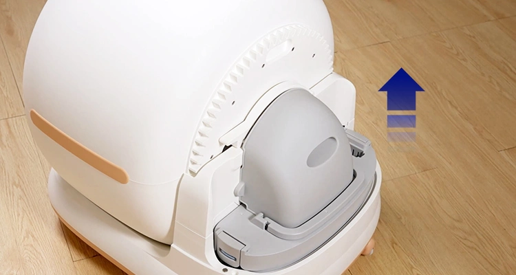 A close-up of a Petrust CB002 automatic litter box with the top section removed to show the waste drawer, illustrating automatic litter box cleaning tips for waste disposal.