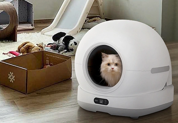 Top Rated Smart Pet Product Manufacturers in China Petrusts Automatic Cat Litter of Smart Pet Product Manufacturers in China A fluffy cat peeking out of a white, spherical automatic litter box, representing a product from top-rated smart pet product manufacturers in China.