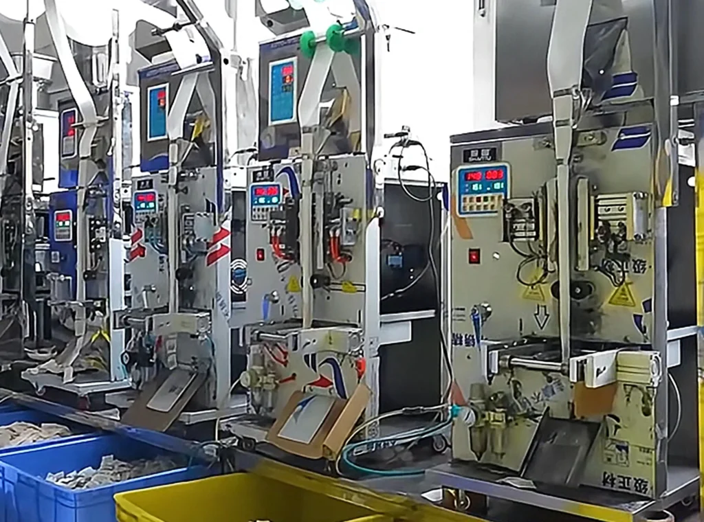 How We Build Every Automatic Cat Water Fountain with Precision Full Quality Inspection of Automatic Cat Water Fountain A row of industrial machinery performing the automated Full Quality Inspection and packaging process for the automatic cat water fountain units.