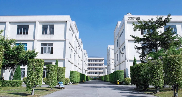 A wide-view image of a large, clean industrial complex with multiple white factory buildings and green landscaping, representing the scale of a major Automatic Litter Box Manufacturer.