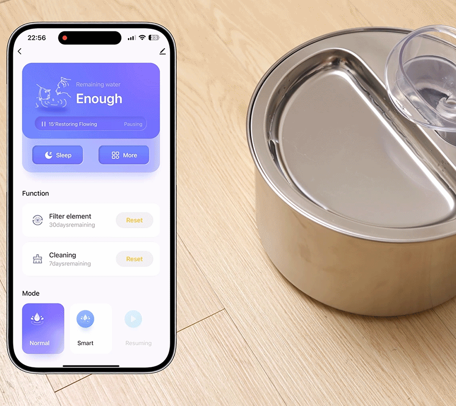 How to Install Use Our Cat Water Fountain Step 6 of Automatic Cat Water Fountain A smartphone screen showing the control app next to the running stainless steel automatic cat water fountain for smart management.