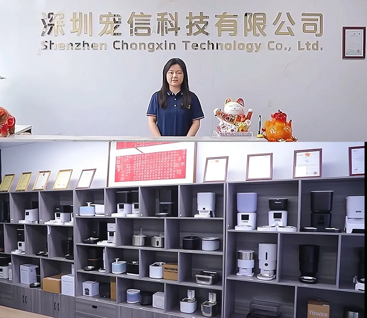 A view of the company's showroom, featuring a display wall lined with various models of smart pet feeders and water fountains, showcasing the product range from an OEM smart cat feeder manufacturer in China.