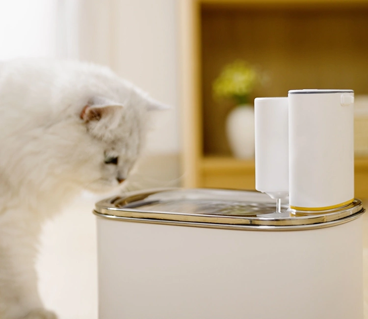 A fluffy white Persian cat curiously sniffing the flowing water of a sleek, white and silver smart pet fountain, showcasing the user-friendly design of a smart cat water fountain manufacturer in China.