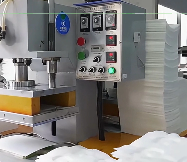 A close-up of an industrial heat press machine's control panel and operation area, used for forming and sealing fountain filter components by a smart cat water fountain manufacturer in China.