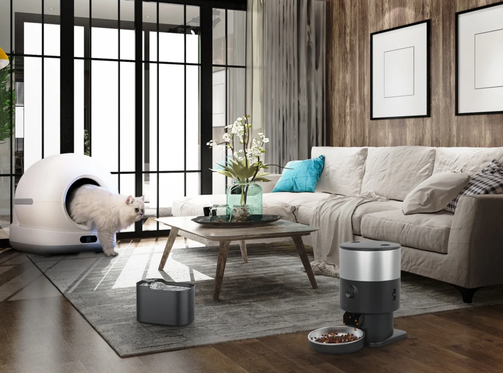 A white cat exits a self-cleaning litter box next to a smart water fountain and automatic feeder, showcasing the integrated ecosystem from the OEM&ODM Smart Pet Products Manufacturer - Petrust® About Us Page.