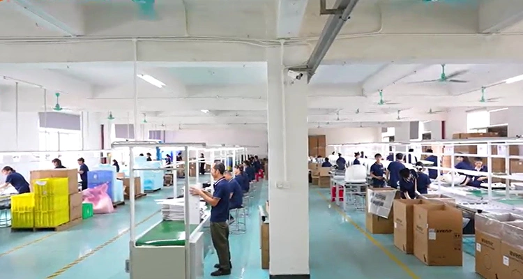 A busy assembly floor where workers at an OEM&ODM Smart Pet Products Manufacturer build and package smart pet devices.