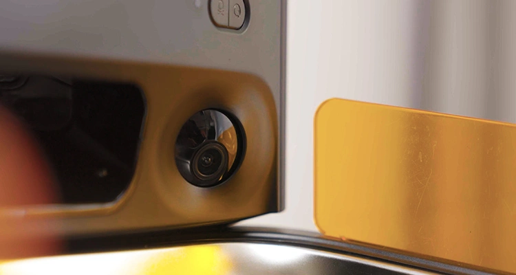 Detailed view of the wide-angle camera lens integrated into the smart automatic feeder for large dogs for remote monitoring.